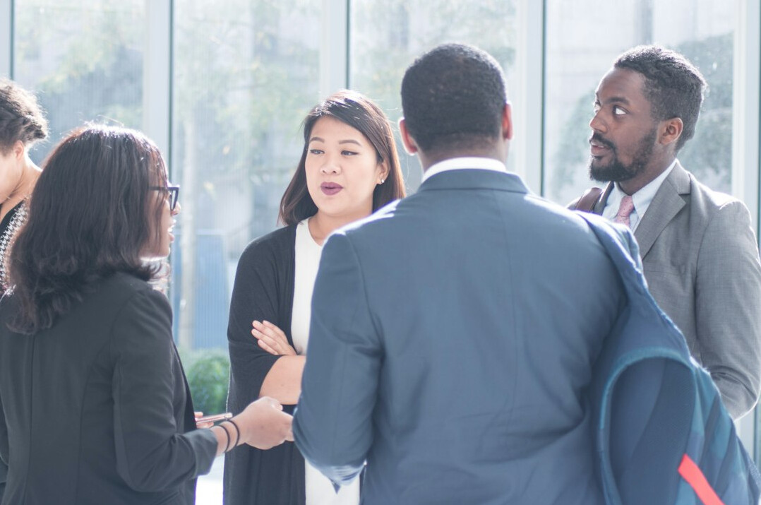 diverse people discussing news