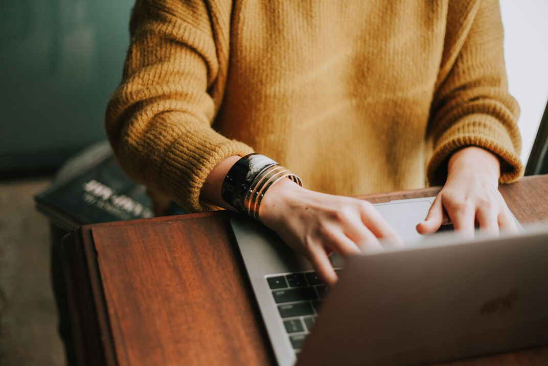 person using laptop fact check
