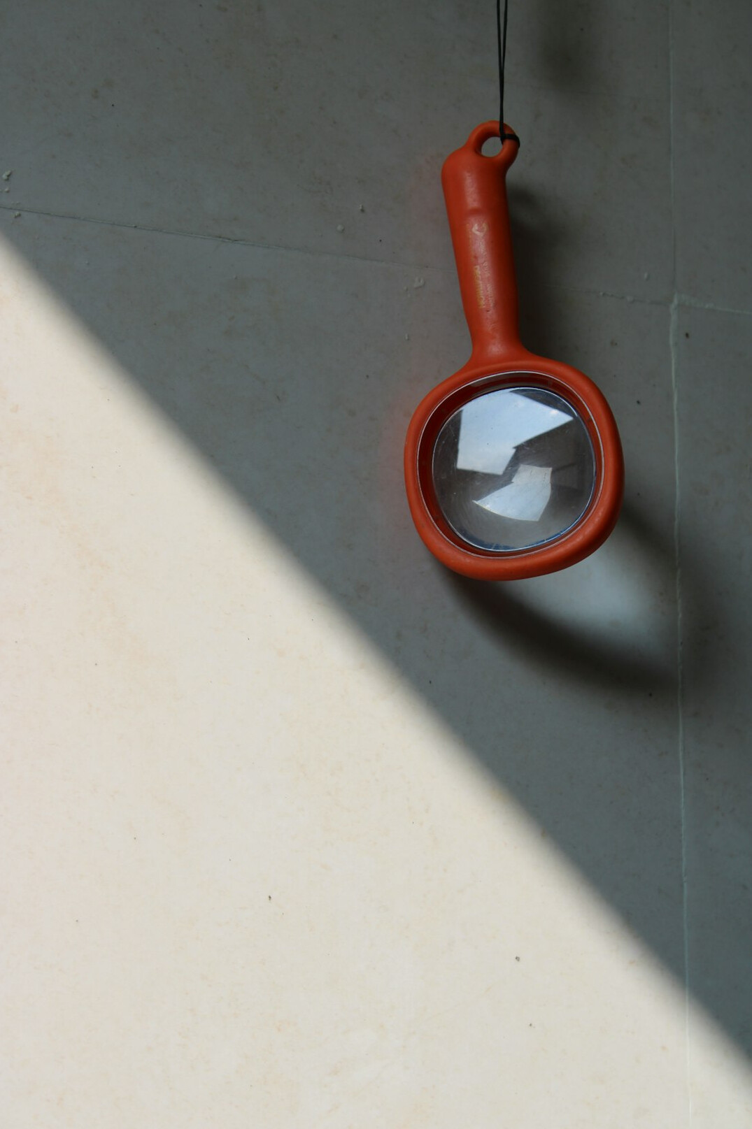 Close-up of a magnifying glass over a printed document